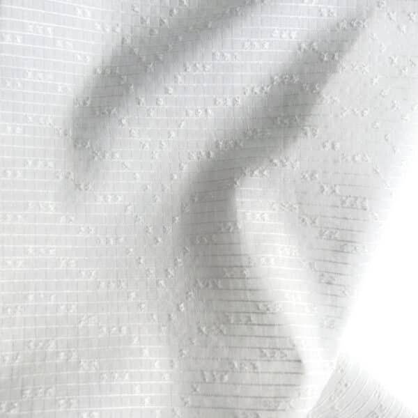 tela algodón relieve geométrico blanco roto